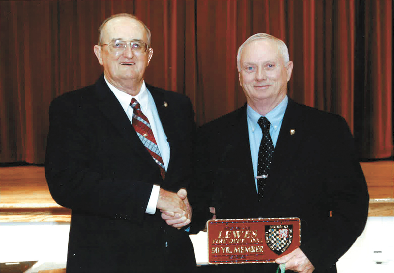 Lewes Fire Department firefighters Pete Dirks, left, and Phil Fitch were honored for 50 years of service this year at the Rehoboth Beach Convention Center. In 1962, The men were Lewes' first junior firefighters. BY CHUCK SNYDER